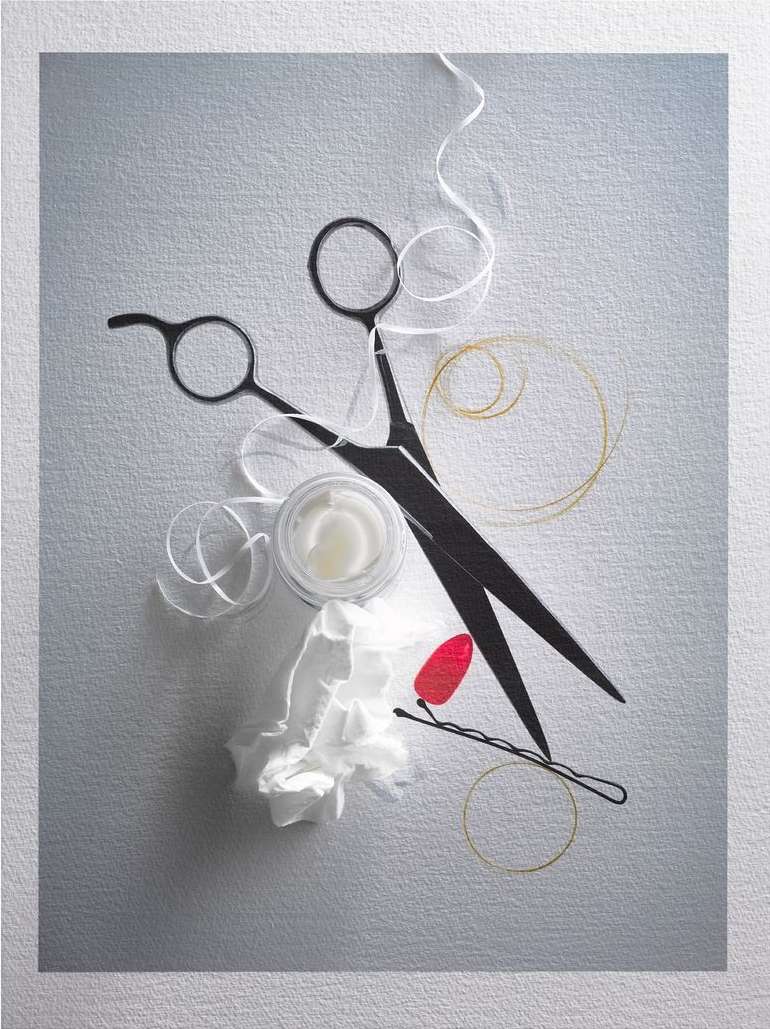 Hairdressing still life: black scissors, hair product, hair tie, bobby pin and tissue on a textured grey surface.
