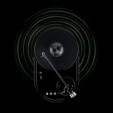 Overhead shot of a black turntable with a needle on a record surrounded by concentric green sound wave lines on a black background.