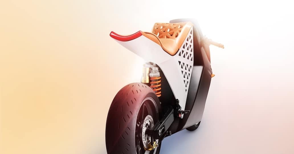Modern motorcycle with a unique geometric design, featuring white and brown accents against a gradient orange and white background.