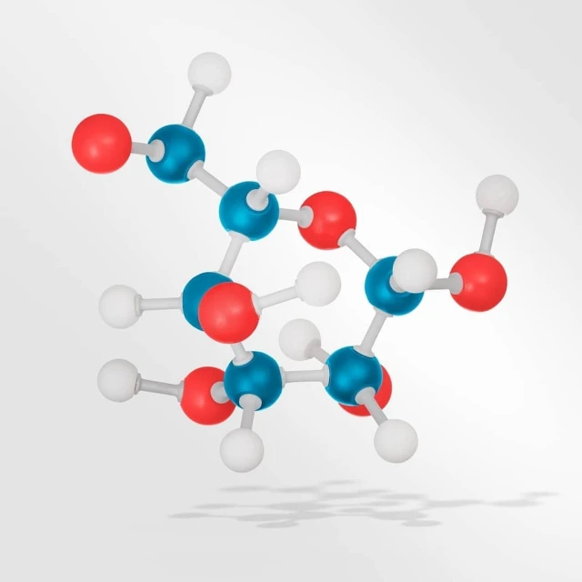 Molecular structure model with red, blue, and white spheres connected by rods, set against a light grey background with a subtle shadow.