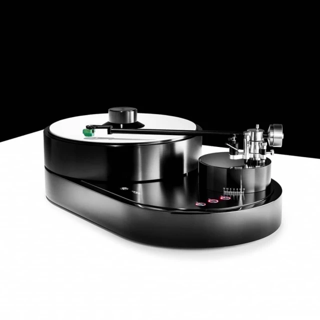 Sleek black turntable with metal arm and white disc, isolated on white surface against black backdrop, studio product shot.