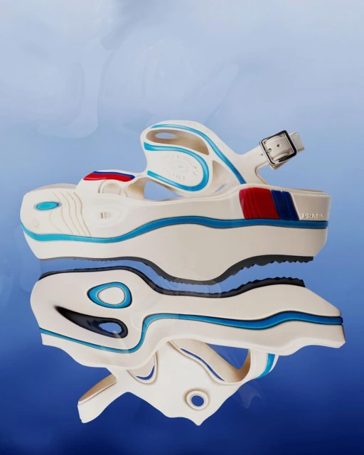 Elevated studio shot of a white platform sandal from Prada, reflected on a surface with light blue gradient backdrop; ideal for fashion content.