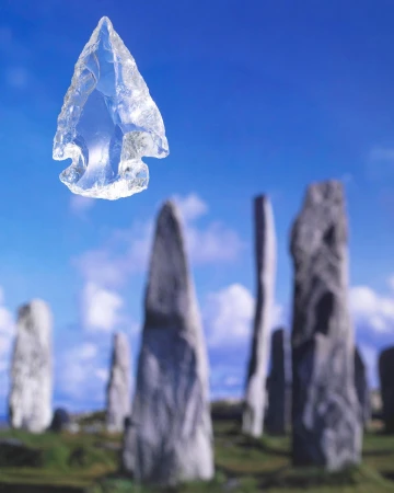 Clear arrowhead with chipped edges against a blue sky and blurred megalithic stone circle in the background, creating an archaeological art photo.
