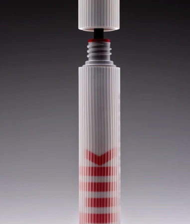 White marker with red writing stands against a gradient gray background, with the top open but the cap hovering just above.