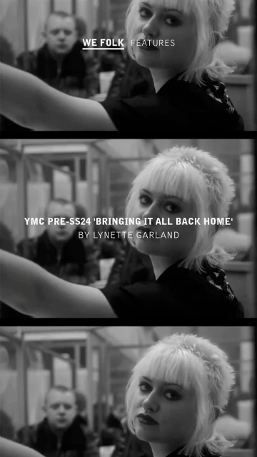 Black and white shot of a woman with bleached blonde hair looking at the camera with a man in the background on a bus.