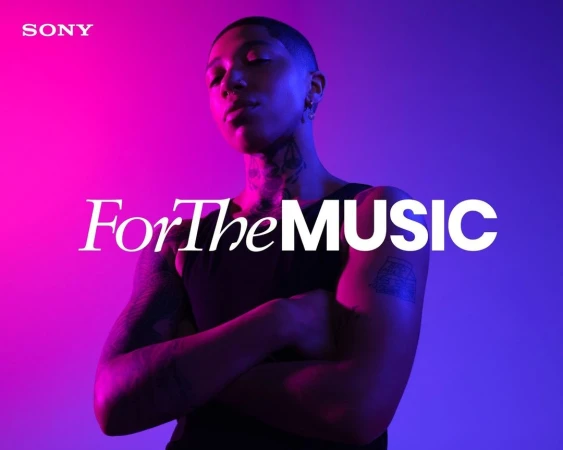 Close-up of a person with crossed arms against a vivid pink and blue background, promoting Sony's focus on music experience.