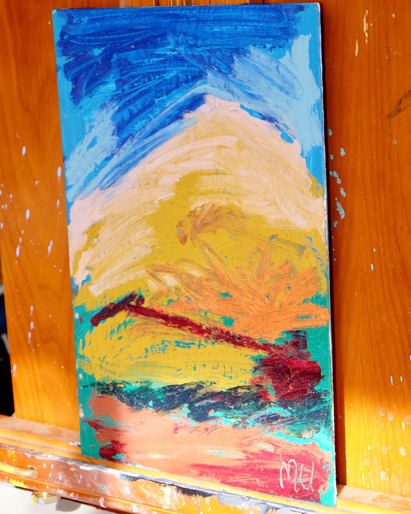 Abstract painting on canvas with hues of blue, yellow, and red; textured brushstrokes evoke a sky and landscape scene.