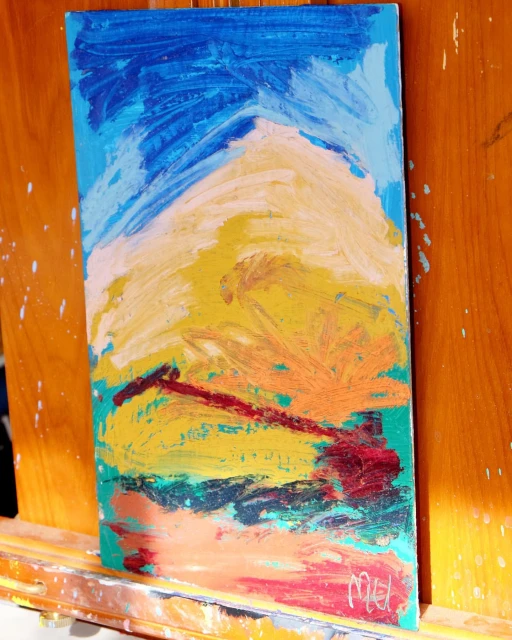 Abstract painting on canvas with hues of blue, yellow, and red; textured brushstrokes evoke a sky and landscape scene.