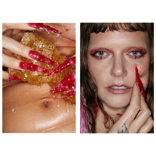 Artistic close-up of a woman with long red nails holding honeycomb, makeup with red accents, against a light studio background.