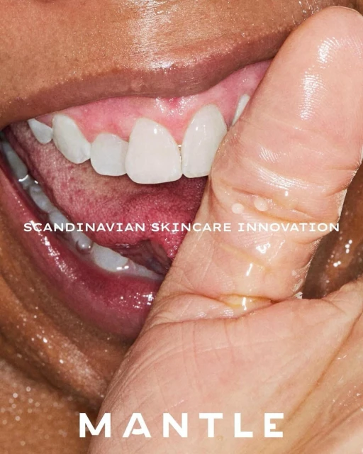 Close-up on light-skinned woman's face with mouth slightly open, finger on teeth, fair skin, shiny lips, and text overlay.
