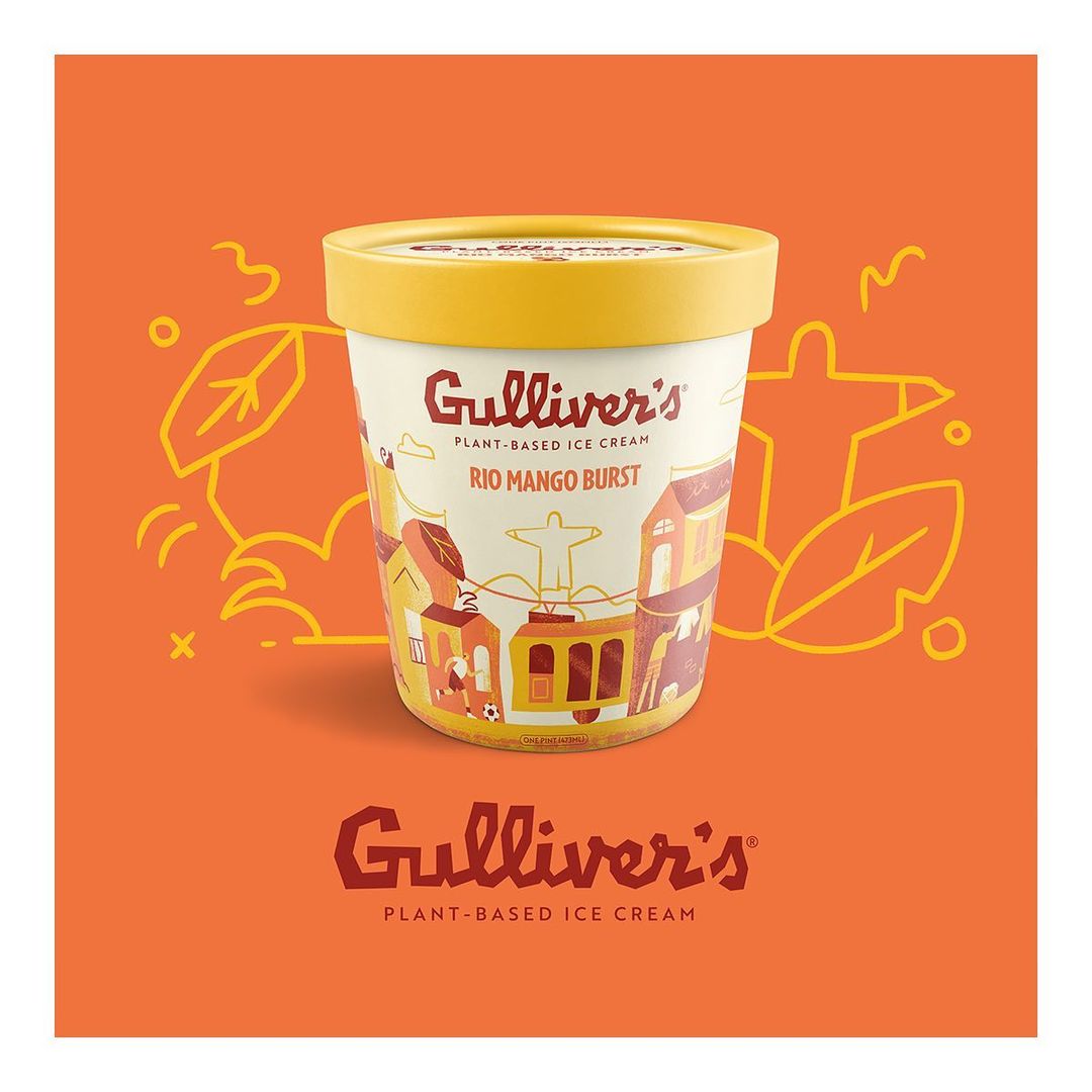 Eye-level studio shot of a pint of Gulliver's Rio Mango Burst plant-based ice cream set against an orange background with line-art leaves.