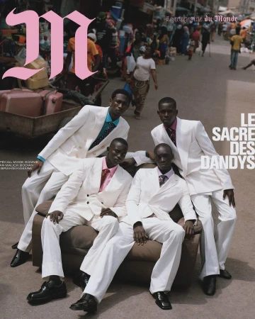 Editorial fashion shot: four black men in white suits pose on a couch in a busy urban street for magazine cover. Magazine graphic on top.
