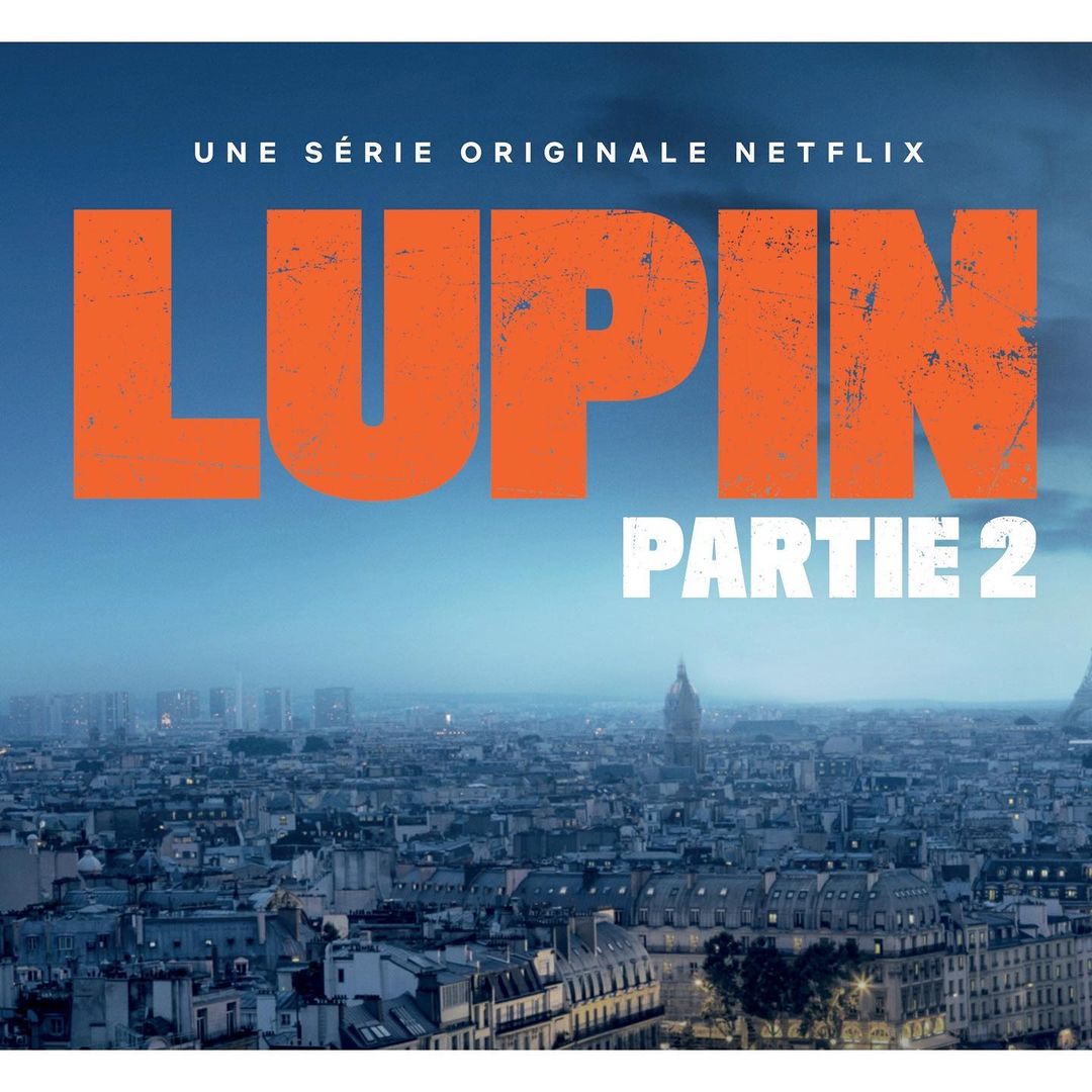 Lupin Part 2 poster featuring a cityscape with the Eiffel Tower. Title text in orange and white against a gradient blue sky.