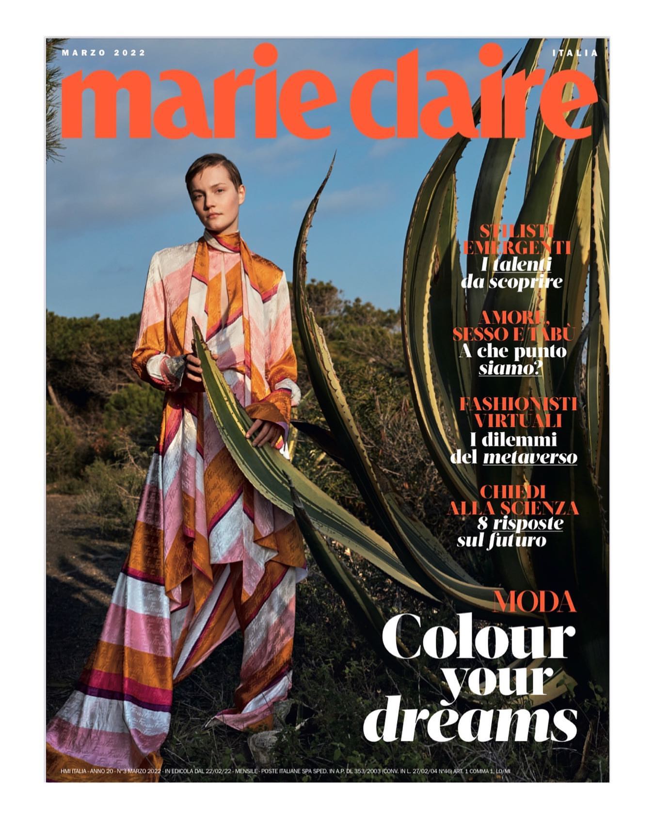 Marie Claire Italia magazine cover featuring a woman in a patterned outfit, posing near a large agave plant under a bright sky.
