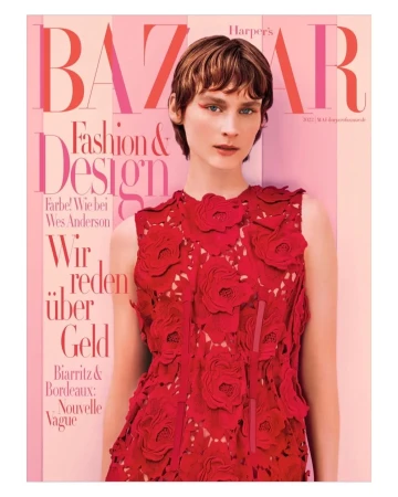 Harper's Bazaar magazine cover featuring a model with short hair in a red floral dress against a pink background. Fashion and design theme.