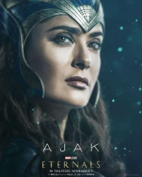 Close up portrait of Salma Hayek wearing an ornate golden headdress and celestial armor as Ajak in Eternals