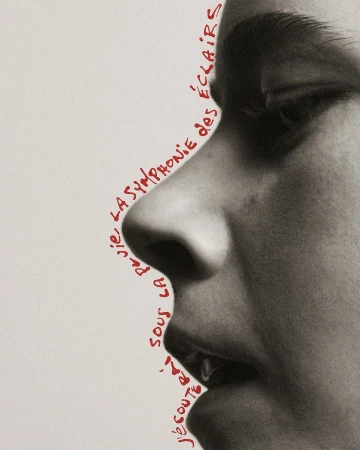 Close-up profile of a person's face with red handwritten text art outlining the contours on a neutral background in a studio.