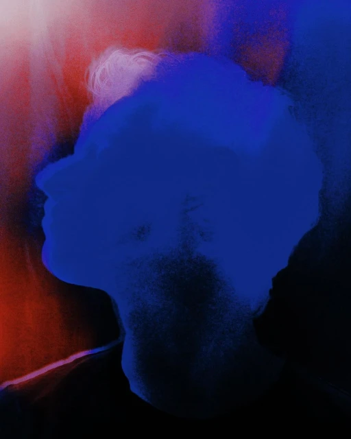 Artistic blurred digital portrait of an adult man with short hair against a blurred red and white background with blue overlay. 
