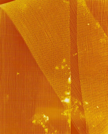 Close-up abstract view of mesh netting material with spots of discoloration, textured surface with a yellow-orange color cast. 