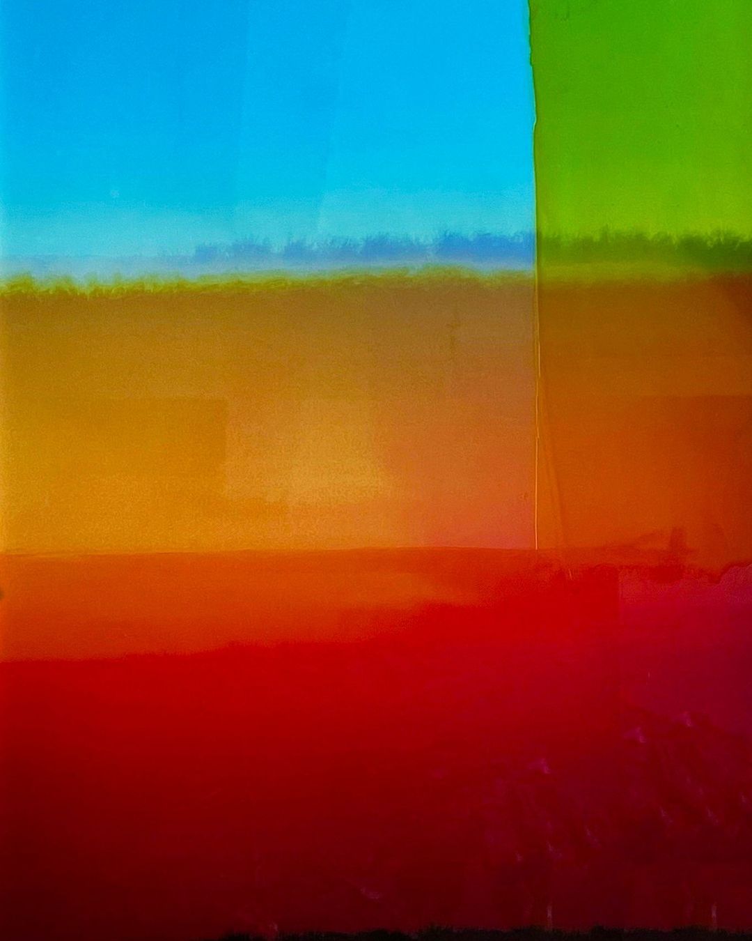 Abstract painting with a gradient of colors from red to blue, with a section of green in the upper right and an implied horizon line.