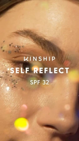 Close-up portrait of a person skin adorned with glitter around the eye, photographed by Maria Del Rio.