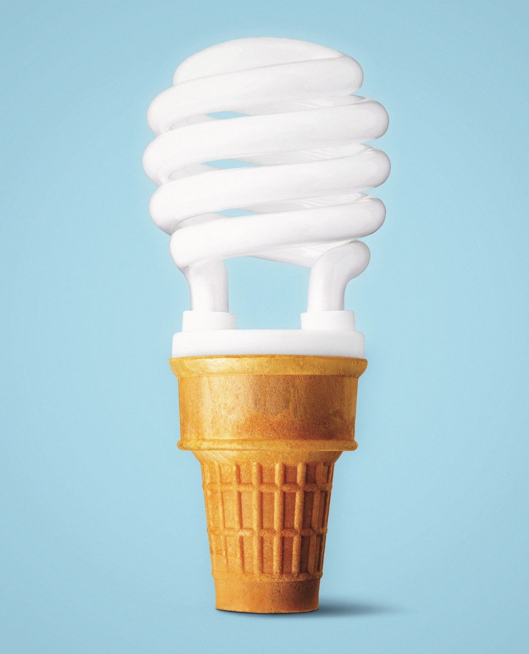 Energy-efficient light bulb with an ice cream cone base against a light blue background. A modern, eco-friendly take on illumination.