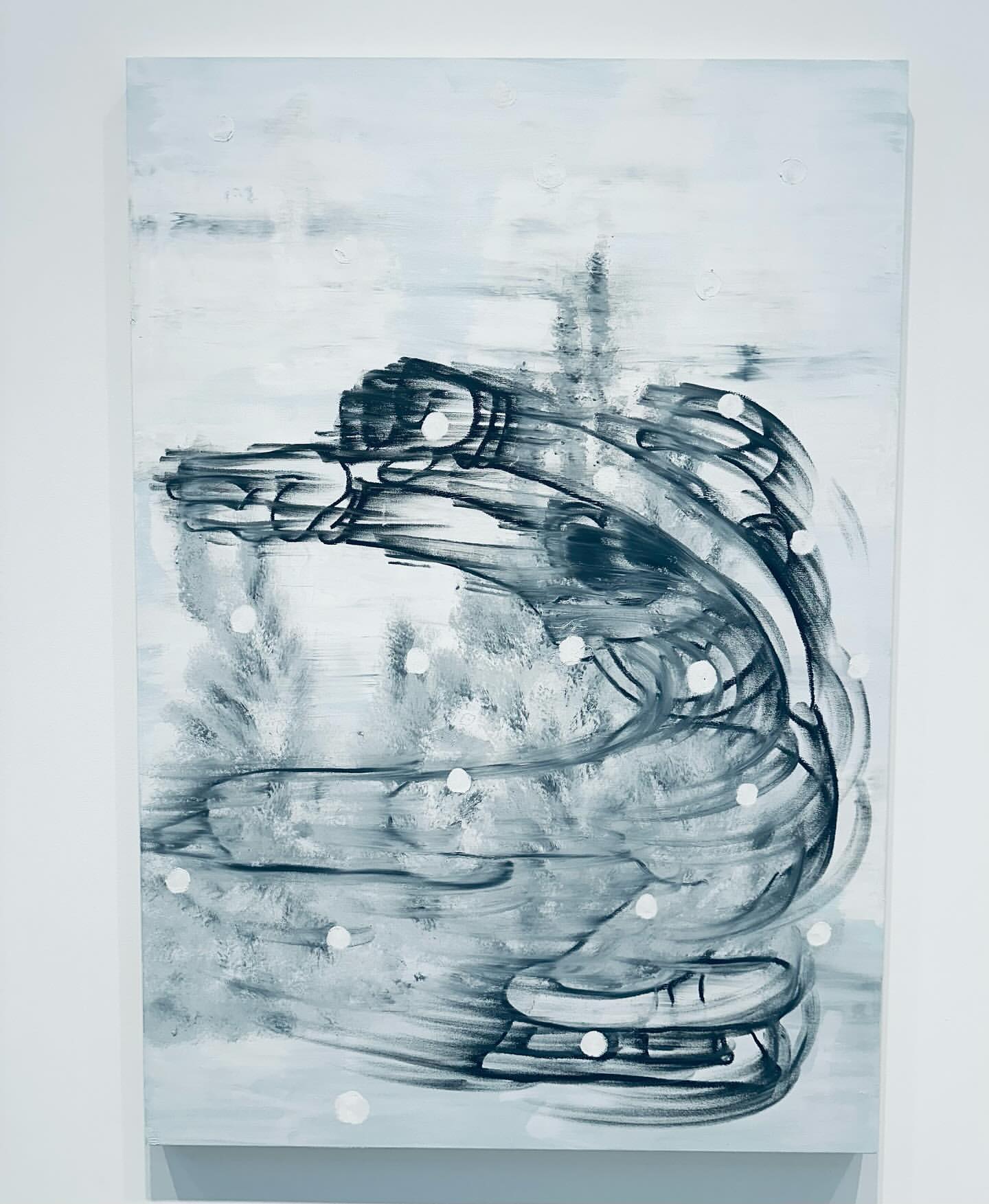 Abstract painting of ice skates in motion with a blurred effect, rendered in grayscale tones and white dots on canvas.