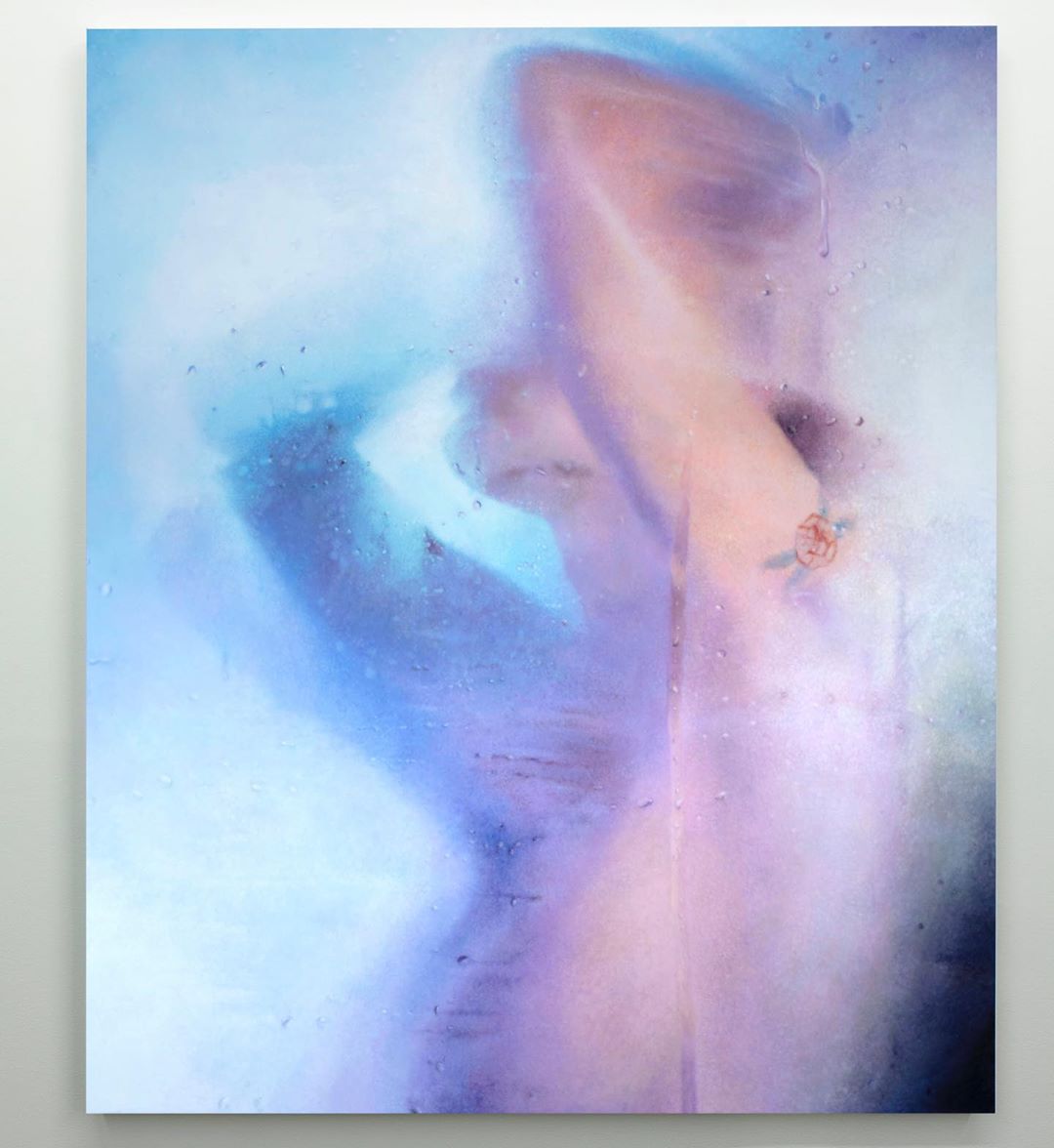 Abstract oil painting of a blurred nude figure in a blue ethereal space, evoking a dreamy and artistic aesthetic. Artwork on a white wall.