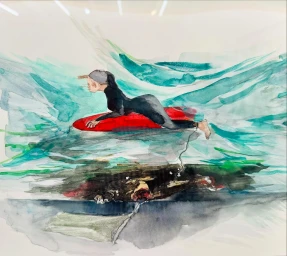 Watercolor painting of a person in a black wetsuit lying on a red surfboard over teal waves by Marilyn Minter.