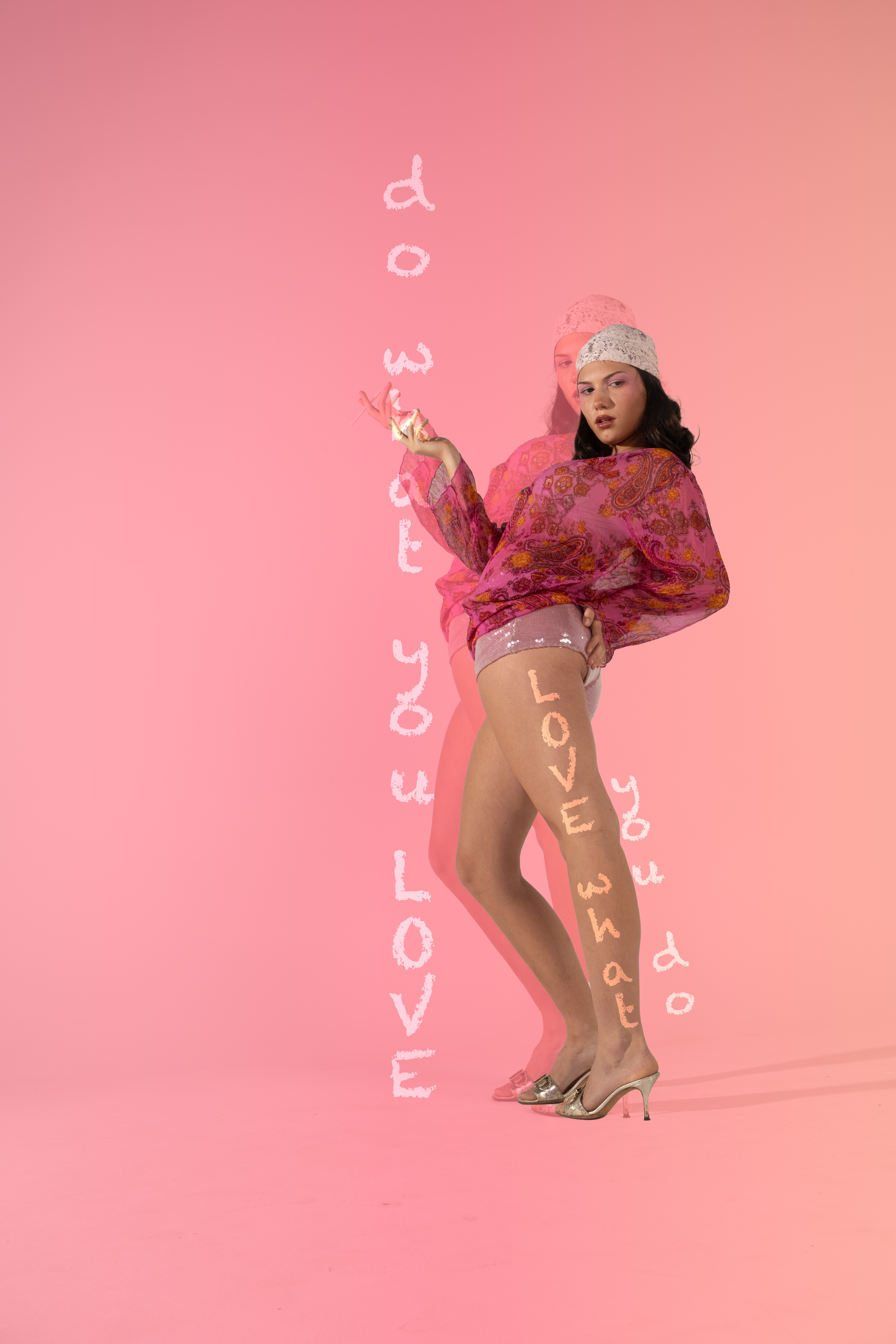 Woman in pink patterned top and headscarf posing against a pink background with overlaid text by Violet Johnston