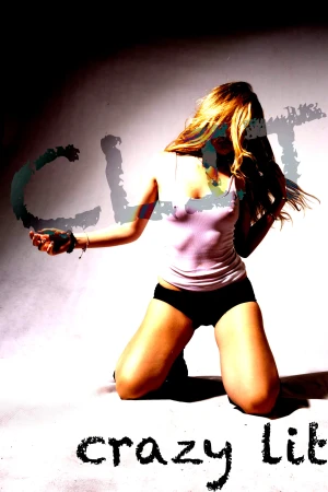 A woman with long blonde hair kneeling in a white studio setting wearing a light top and dark shorts, photographed by Violet Johnston.