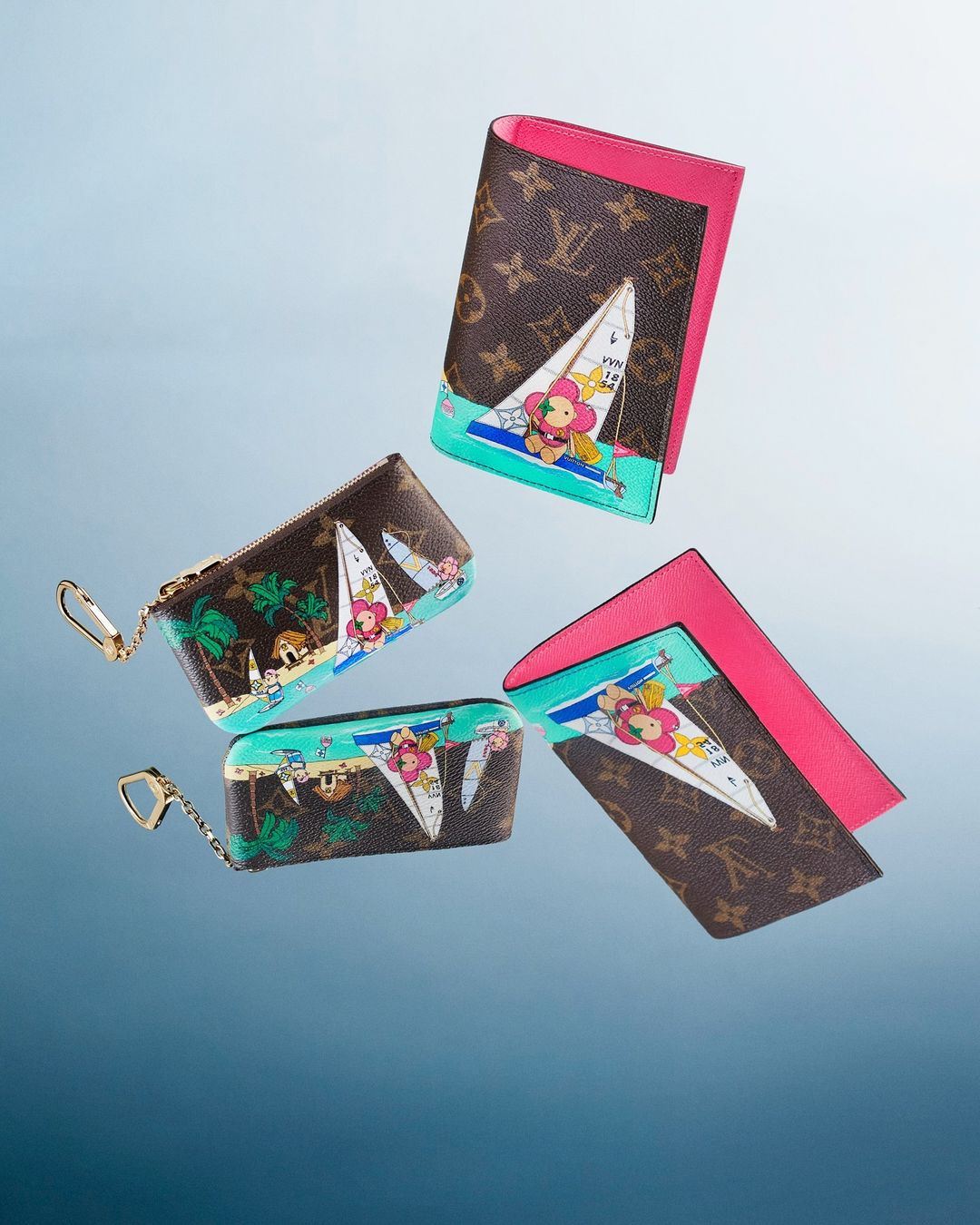 Louis Vuitton wallets and cardholders featuring colorful cartoon sailboat designs floating against a soft blue gradient background.