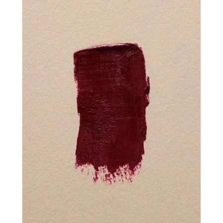 Deep burgundy lipstick swatch on textured beige paper surface photographed by Marius W Hansen