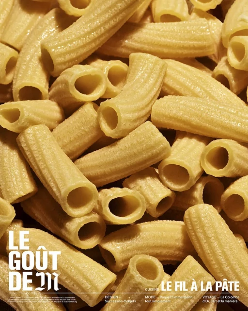 Close-up photograph features an arrangement of rigatoni pasta, highlighted with light, creating a culinary-themed visual texture.