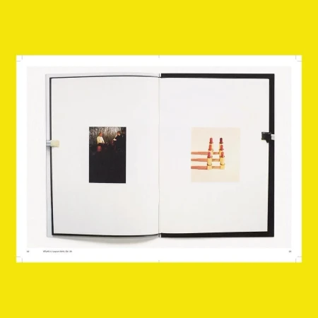 Open book displays photographs: one of a group of people in a forest and another of six lipsticks arranged in two columns.