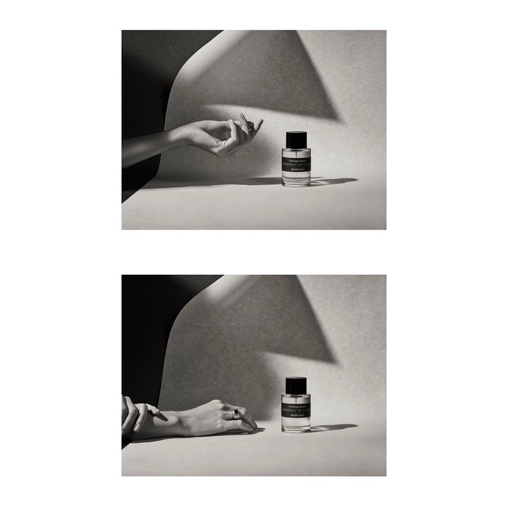 Two close-up studio shots featuring a hand and a glass perfume bottle, set against a cream and black backdrop, accented by soft, natural lighting.