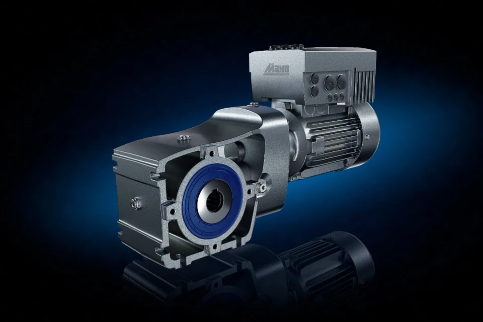 Close-up studio shot of a cutaway grey metal industrial gearbox with blue detail and motor. Dark blue-black background with reflection.