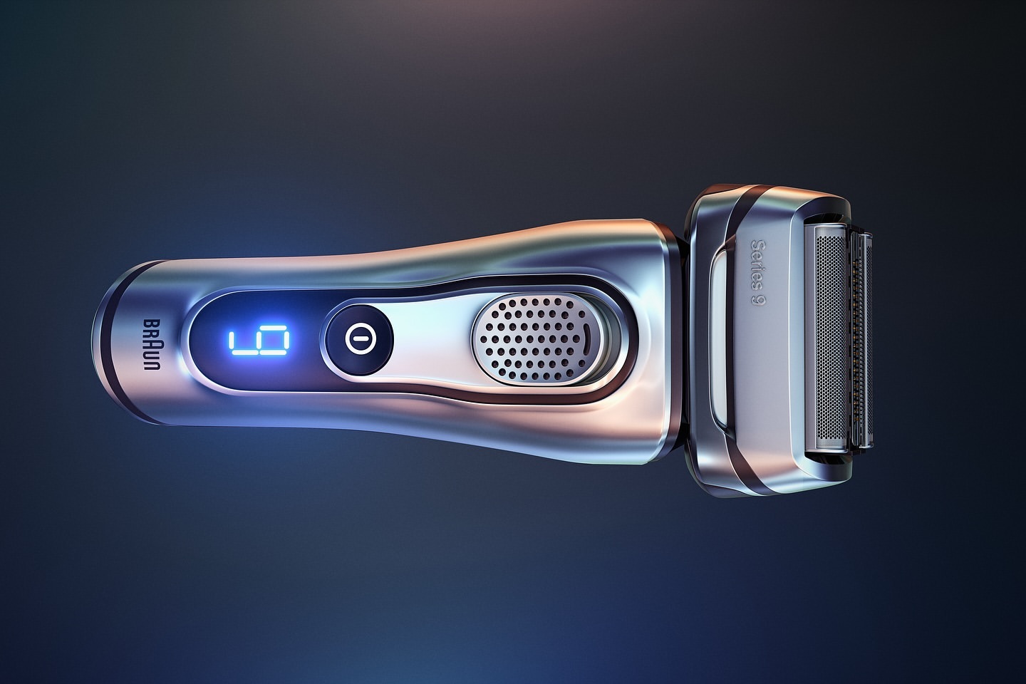Shiny silver electric shaver on dark blue background featuring a digital display and sleek design; beauty and personal care product.