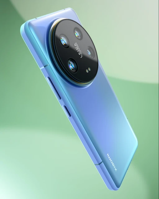 Close-up product shot of a light blue Xiaomi smartphone showcasing its circular multi-lens camera on a soft green gradient background.