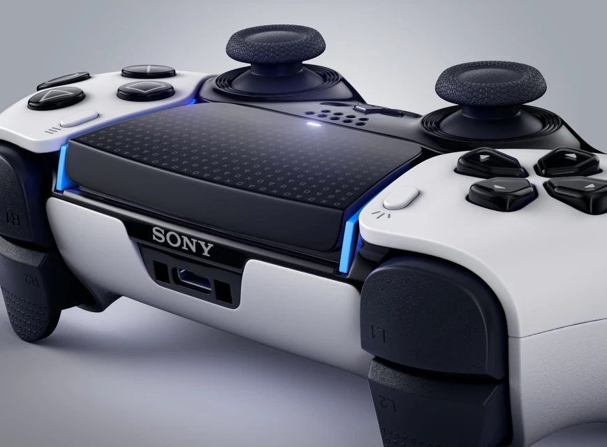 Close-up studio shot of a white and black Sony PlayStation 5 DualSense Edge Wireless Controller, angled view showcasing design and features.