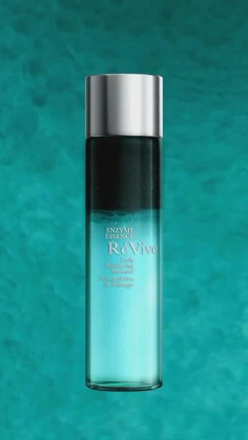 Revive Enzyme Essence bottle against a teal backdrop featuring the product's container in gradient hues and silver accents.