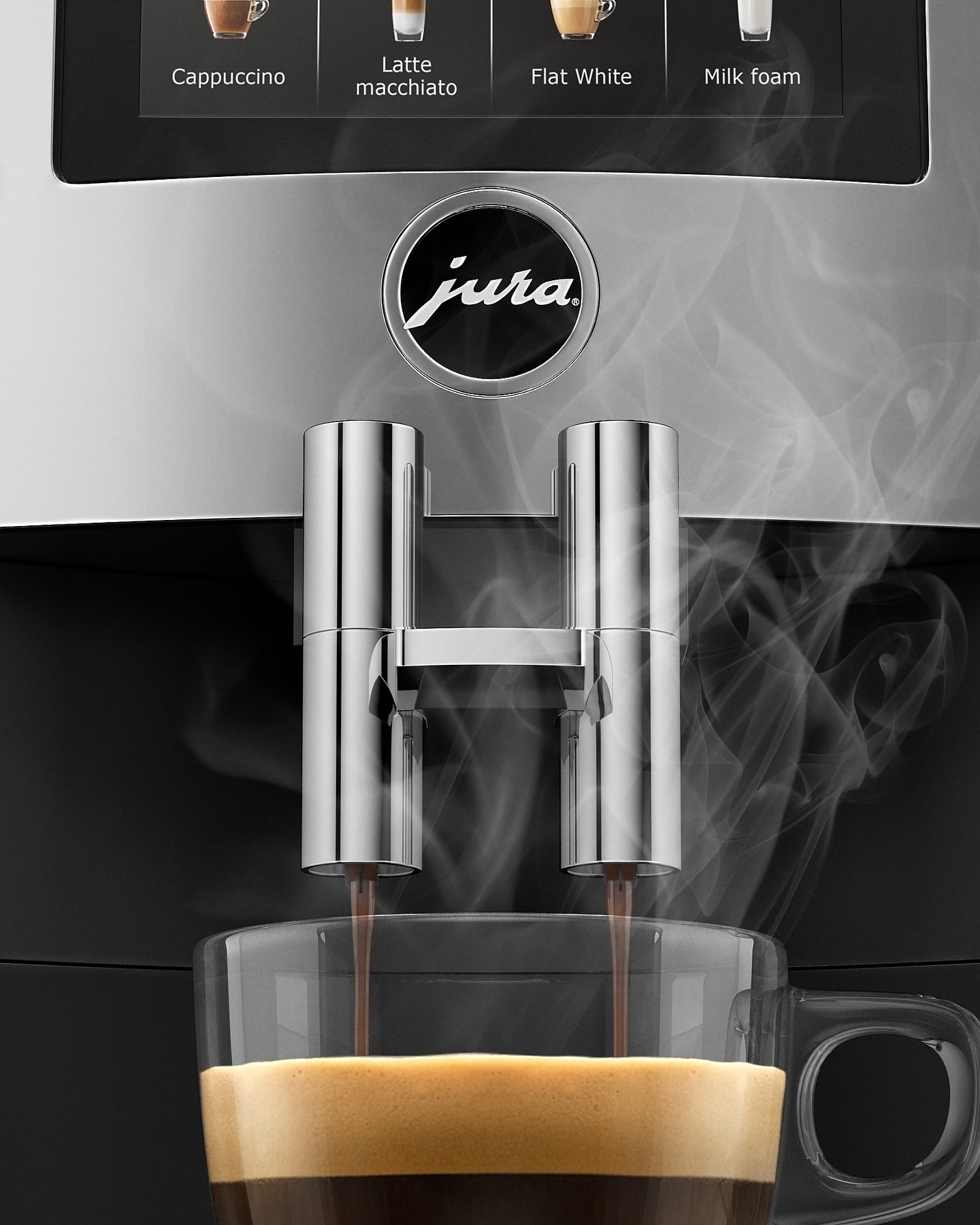 Espresso pours into a glass cup from a Jura coffee machine, close-up, with visible steam and coffee options displayed on the machine.