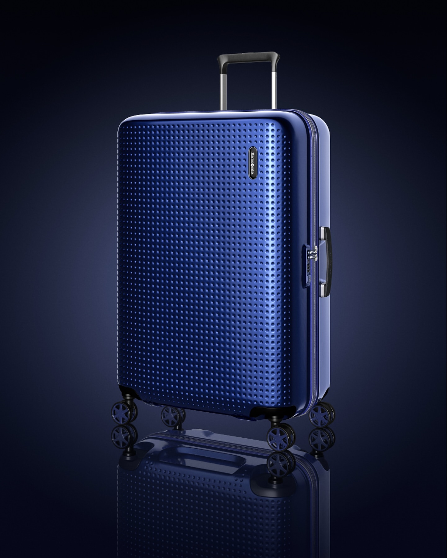 Studio shot of a dark blue Samsonite suitcase with a textured surface and a telescoping handle extended, set against a dark blue gradient.