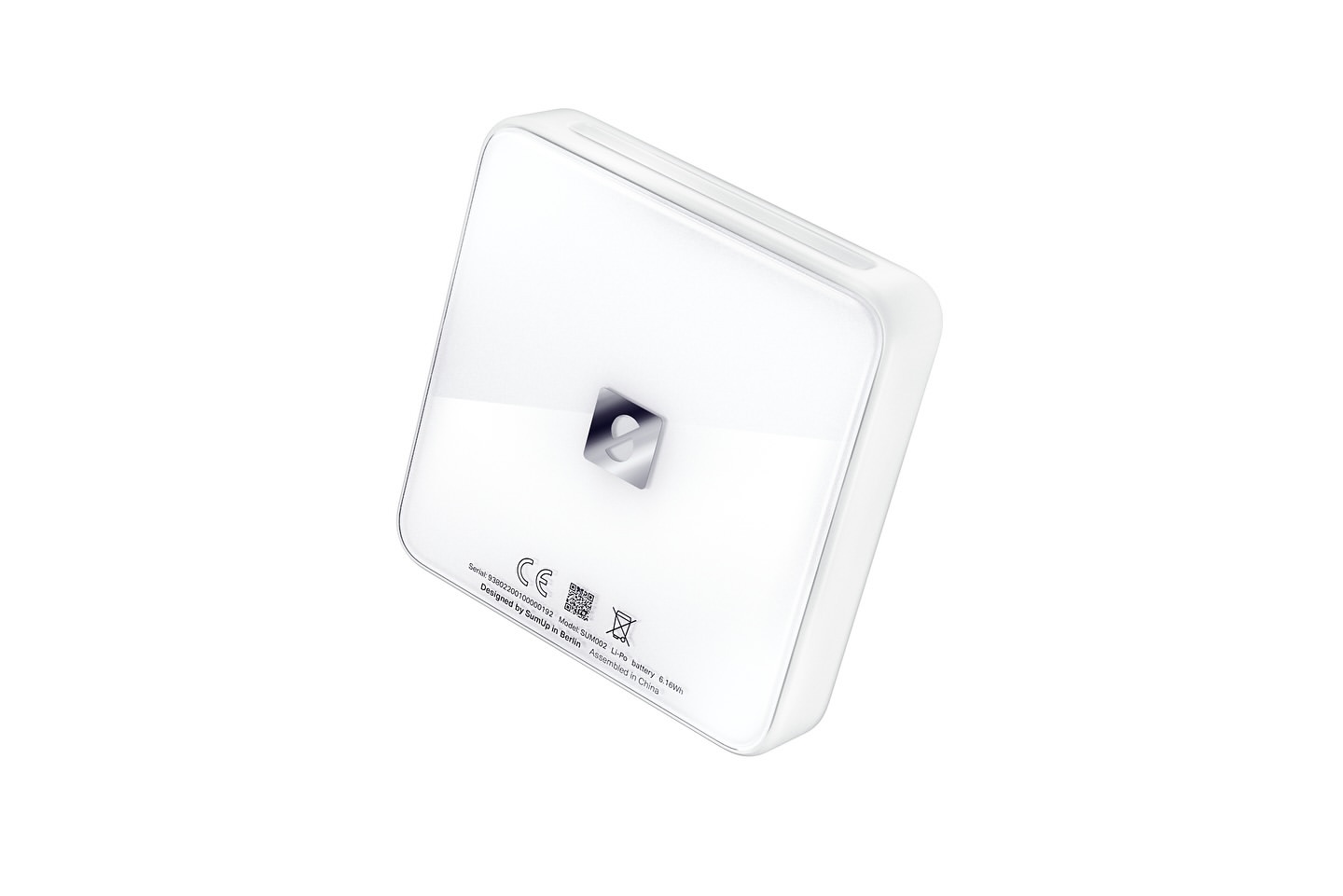Close-up studio shot of a white, square-shaped device with rounded edges, featuring a reflective logo at its center, against a white background.