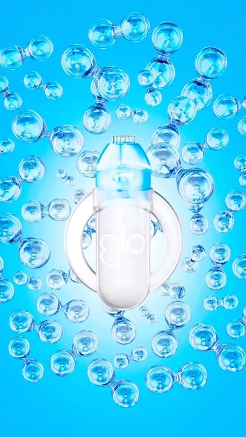 Water bottle surrounded by molecule structures in a blue gradient background, emphasizing a clean, refreshing drink presentation.