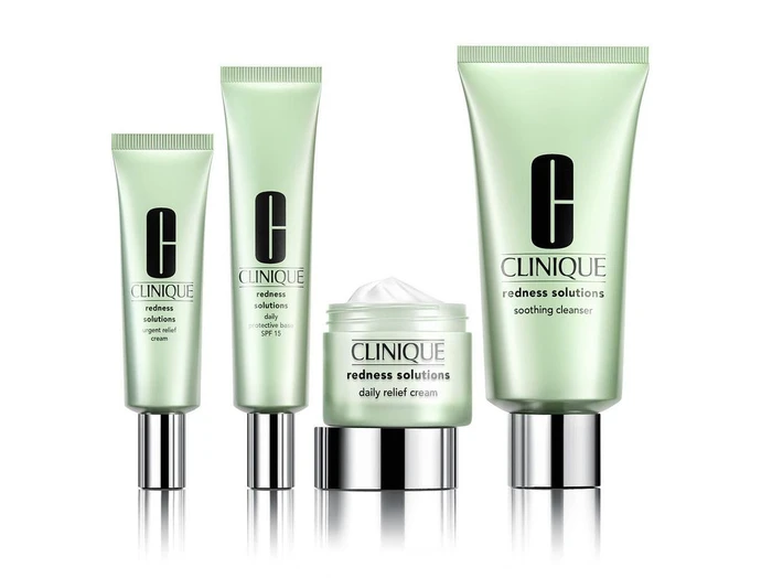 Four Clinique skincare product containers including three squeeze tubes and a jar arranged against white