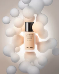 Chanel foundation bottle surrounded by floating abstract spheres in neutral tones by CGI artist Marius W-z