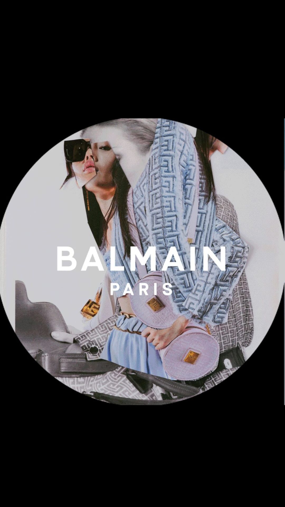 Fashion editorial shot featuring two women in patterned blazers and sunglasses holding handbags against a white background with brand logo.