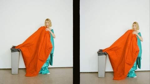 Woman in teal dress holds orange fabric above trash can in a studio environment with a white background, duplicated in a split frame.