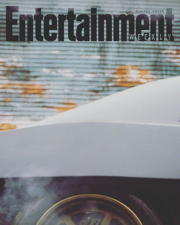 Entertainment Weekly digital cover features a car hood and a partially visible wheel with steam, set against a textured, weathered background.